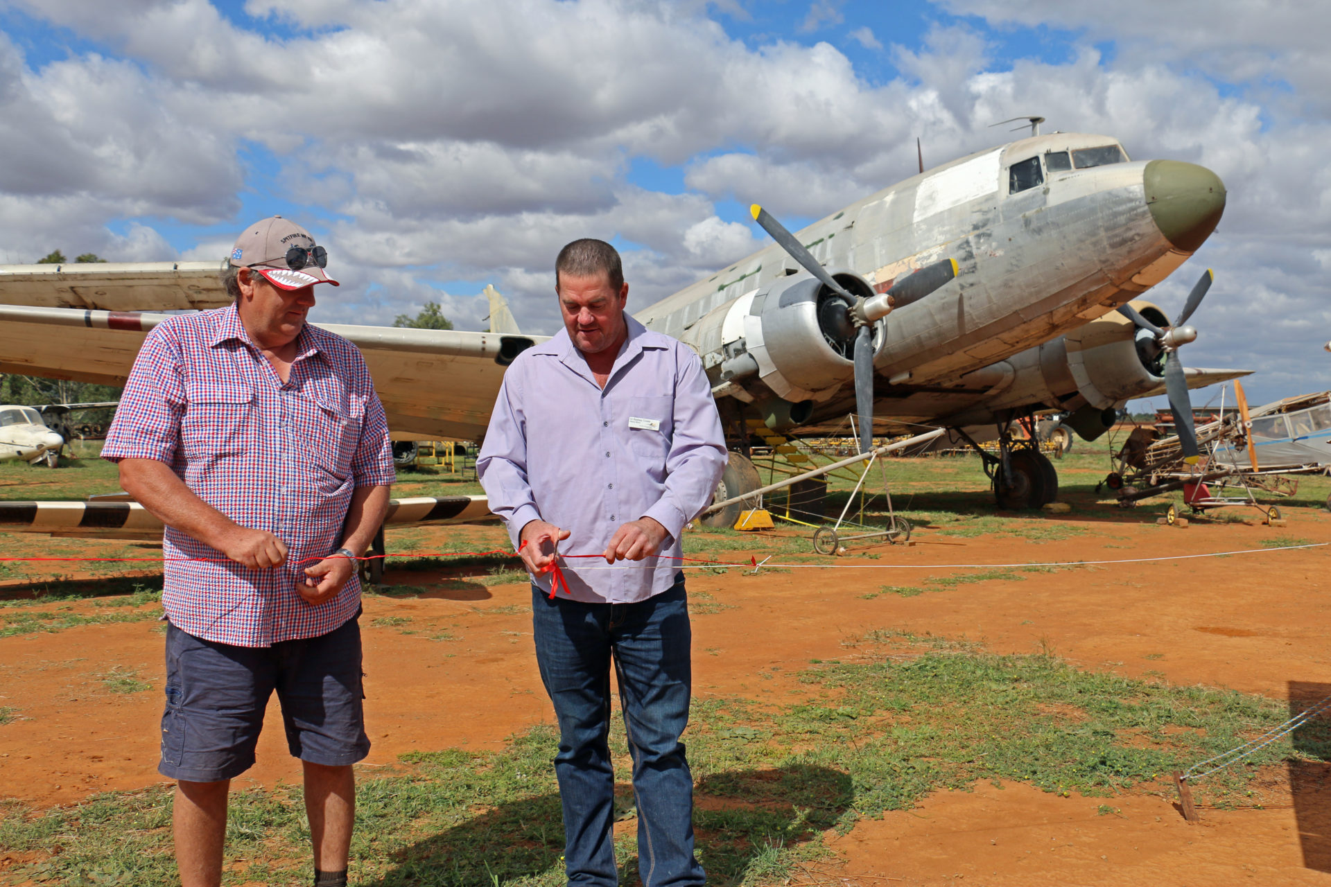 Robert Walker and Rodney Crowe cut the ribbon