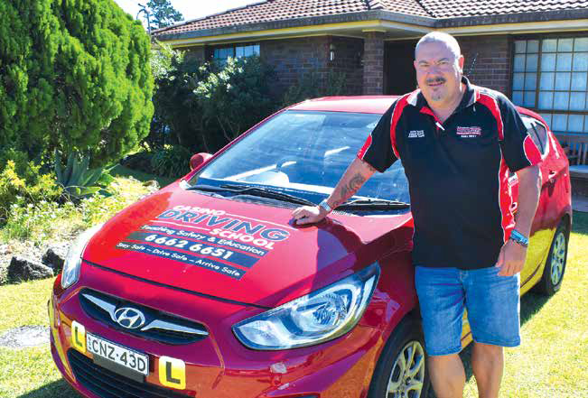 Steve Sun with one of his driving school cars