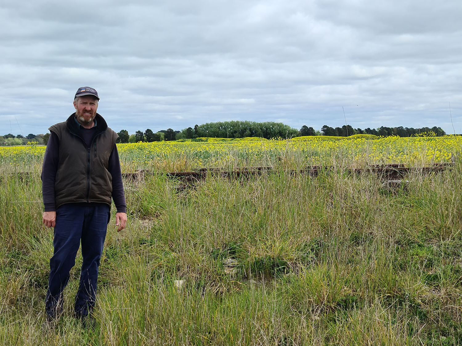 Mr Hocking alongside the railway line