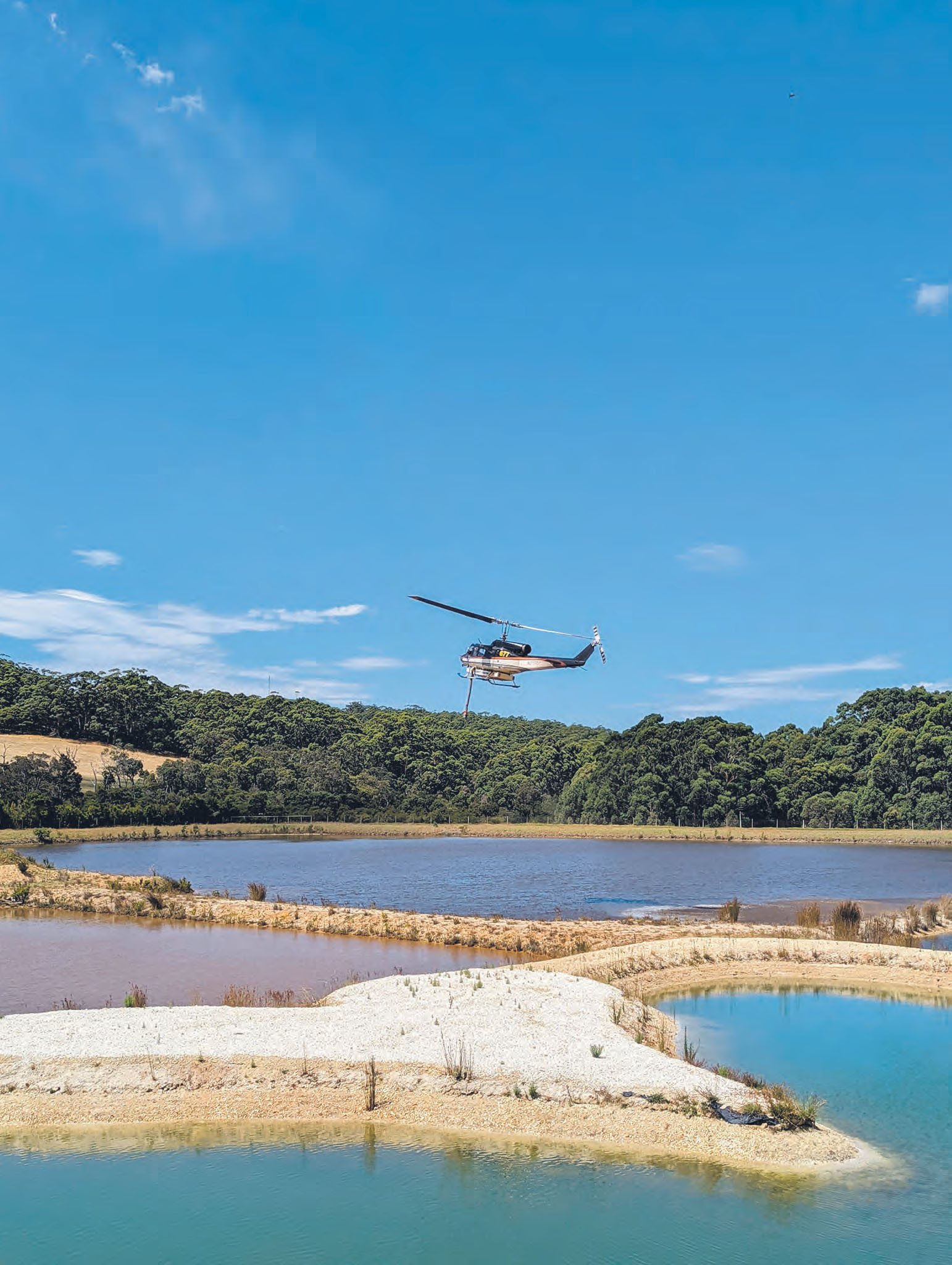 Helicopter tops up at dam