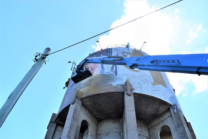Casino water tower mural in progress