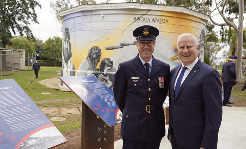 Member for Riverina Michael McCormack (right) with an RAAF officer and at left the plaque bearing details of the history of No 8 EFTS.