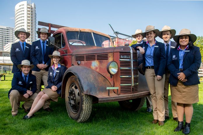 Rural ambassadors around a truck