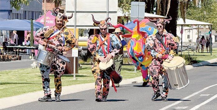 The roving street percussion troupe with the perfectly themed colourful bull mascot. (Photos by Blake Lee.)